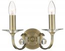 A Double-Arm Wall Light Finished in Antique Brass ID